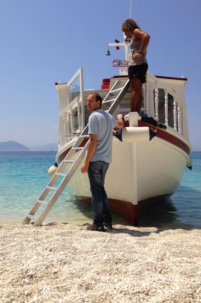 The ferryman waits in vain for people leaving Agiofili beach